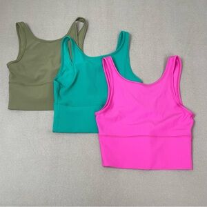 Lululemon set 3 Power Pivot Ribbed Tank Top
Hot pink green teal size 4